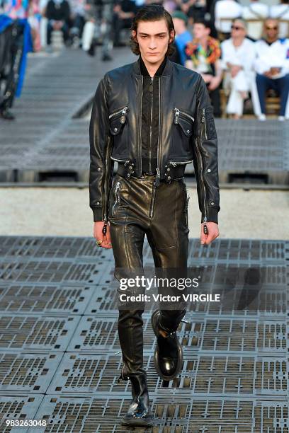 Model walks the runway during the Alexander McQueen Menswear Spring/Summer 2019 fashion show as part of Paris Fashion Week on June 22, 2018 in Paris,...