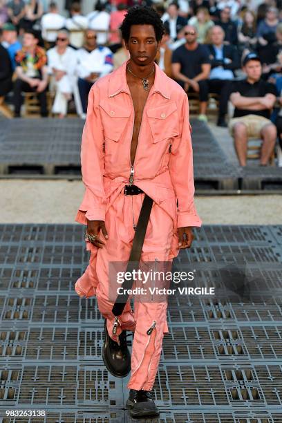 Model walks the runway during the Alexander McQueen Menswear Spring/Summer 2019 fashion show as part of Paris Fashion Week on June 22, 2018 in Paris,...