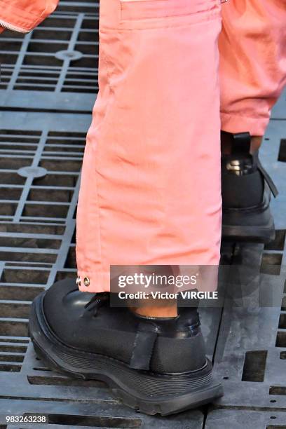 Model walks the runway during the Alexander McQueen Menswear Spring/Summer 2019 fashion show as part of Paris Fashion Week on June 22, 2018 in Paris,...