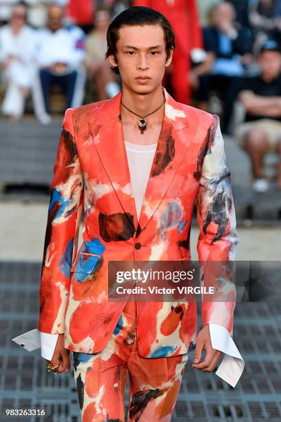 Model walks the runway during the Alexander McQueen Menswear Spring/Summer 2019 fashion show as part of Paris Fashion Week on June 22, 2018 in Paris,...