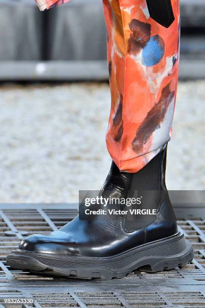 Model walks the runway during the Alexander McQueen Menswear Spring/Summer 2019 fashion show as part of Paris Fashion Week on June 22, 2018 in Paris,...