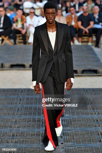 Model walks the runway during the Alexander McQueen Menswear Spring/Summer 2019 fashion show as part of Paris Fashion Week on June 22, 2018 in Paris,...