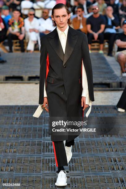 Model walks the runway during the Alexander McQueen Menswear Spring/Summer 2019 fashion show as part of Paris Fashion Week on June 22, 2018 in Paris,...