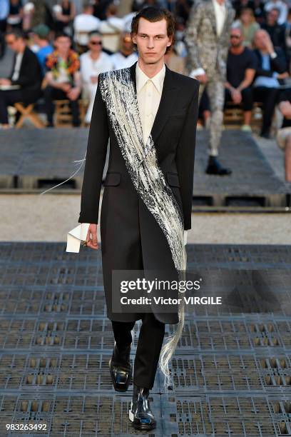 Model walks the runway during the Alexander McQueen Menswear Spring/Summer 2019 fashion show as part of Paris Fashion Week on June 22, 2018 in Paris,...