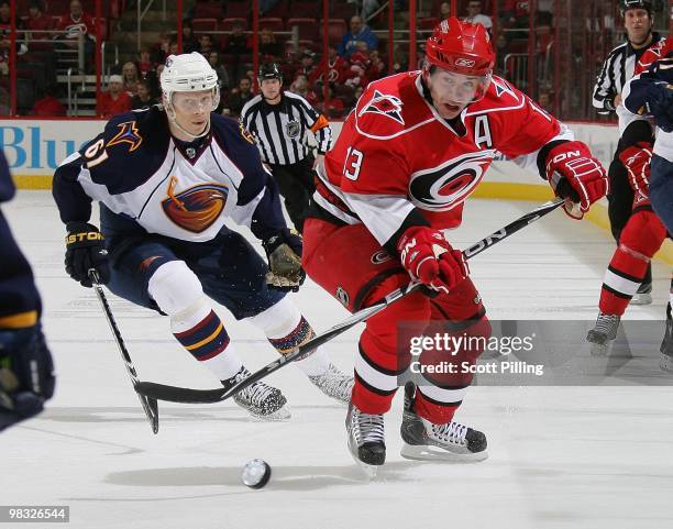 Ray Whitney of the Carolina Hurricanes skates the puck into the defensive zone of the Atlanta Thrashers during their NHL game on March 27, 2010 at...