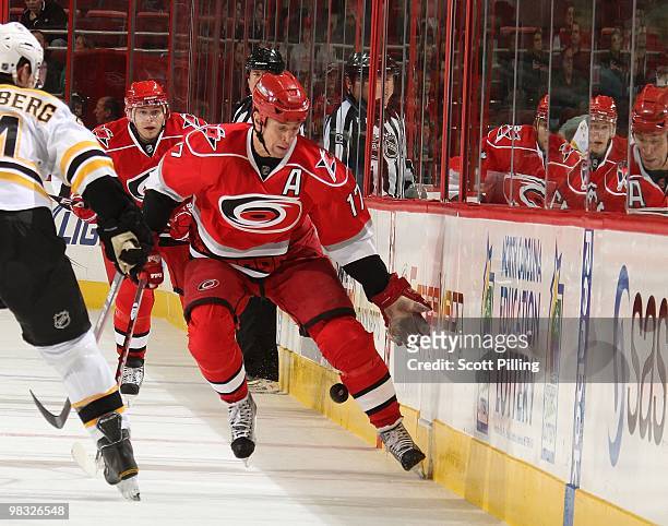 Rod Brind'Amour of the Carolina Hurricanes deflects the puck back to the ice with his glove during their NHL game against the Boston Bruins on March...
