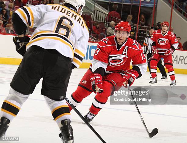 Ray Whitney of the Carolina Hurricanes skates the puck into the defensive zone of the Boston Bruins during their NHL game on March 16, 2010 at the...