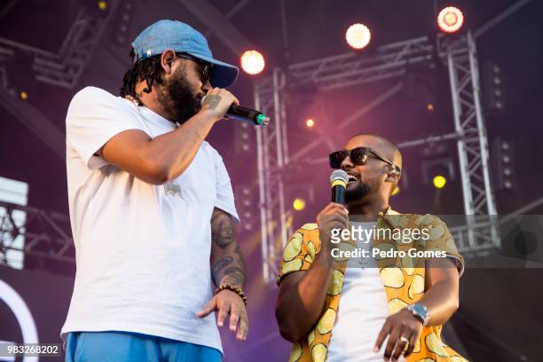 With guest artist Emicida during the bands performance on the Music Valley sage on day two of Rock in Rio Lisbon on June 24, 2018 in Lisbon, Portugal.