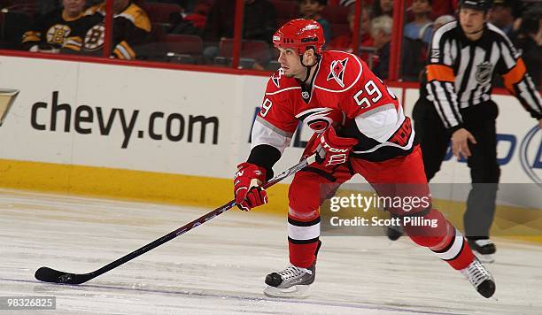 Chad LaRose of the Carolina Hurricanes carries the puck into the defensive zone of the Boston Bruins during their NHL game on March 16, 2010 at the...
