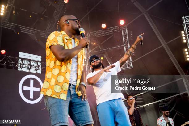 With guest artist Emicida during the bands performance on the Music Valley sage on day two of Rock in Rio Lisbon on June 24, 2018 in Lisbon, Portugal.