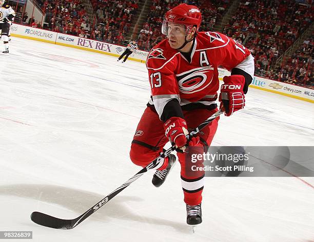 Ray Whitney of the Carolina Hurricanes carries the puck into the defensive zone of the Boston Bruins during their NHL game on March 16, 2010 at the...