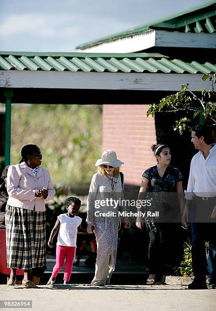 Madonna arrives with adopted Malawian Mercy James and Lourdes at one of the Raising Malawi initiative's - Mphandula Childcare Centre which supports...