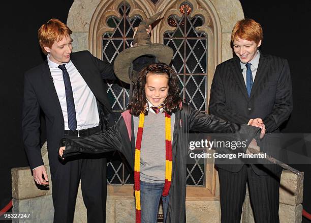 Actors Oliver Phelps and James Phelps attend Harry Potter: The Exhibition at the Ontario Science Centre on April 8, 2010 in North York, Canada.