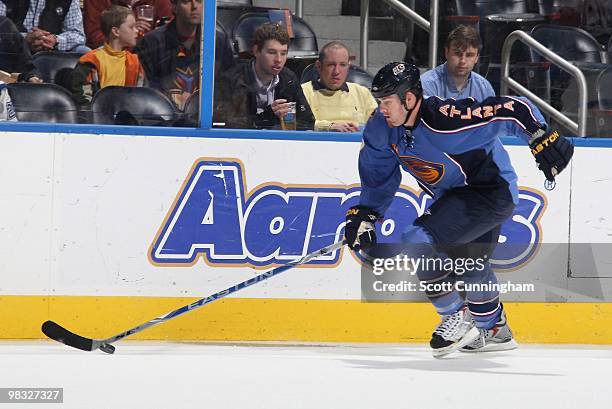 Eric Boulton of the Atlanta Thrashers carries the puck against the Phoenix Coyotes at Philips Arena on March 14, 2010 in Atlanta, Georgia.