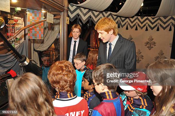 Actors Oliver Phelps and James Phelps attend Harry Potter: The Exhibition at the Ontario Science Centre on April 8, 2010 in North York, Canada.