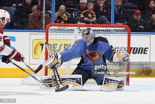 Ondrej Pavelec of the Atlanta Thrashers makes a save against the Phoenix Coyotes at Philips Arena on March 14, 2010 in Atlanta, Georgia.