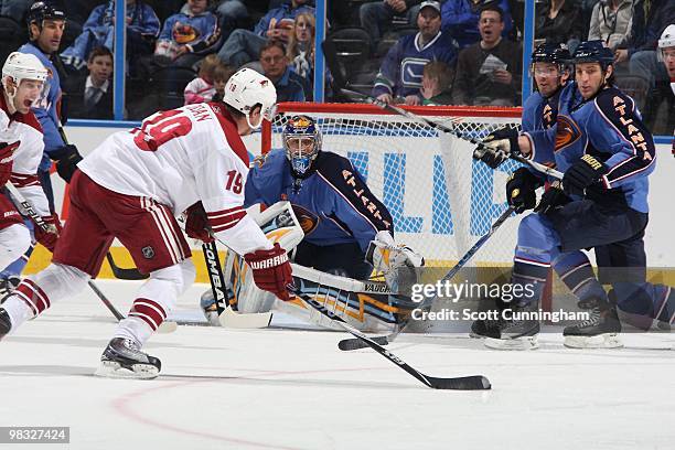 Shane Doan of the Phoenix Coyotes fires a shot against the Atlanta Thrashers at Philips Arena on March 14, 2010 in Atlanta, Georgia.