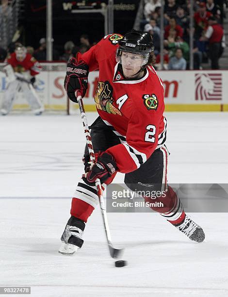 Duncan Keith of the Chicago Blackhawks shoots the puck during a game against the Calgary Flames on April 04, 2010 at the United Center in Chicago,...