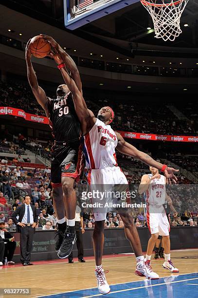 Joel Anthony of the Miami Heat grabs the rebound against Ben Wallace of the Detroit Pistons during the game on March 31, 2010 at The Palace of Auburn...