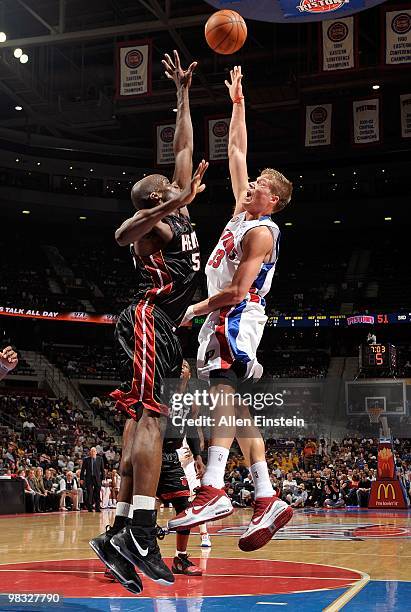 Jonas Jerebko of the Detroit Pistons puts up a shot against Joel Anthony of the Miami Heat during the game on March 31, 2010 at The Palace of Auburn...