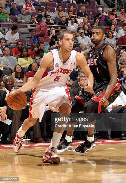 Austin Daye of the Detroit Pistons drives against Dorell Wright of the Miami Heat during the game on March 31, 2010 at The Palace of Auburn Hills in...