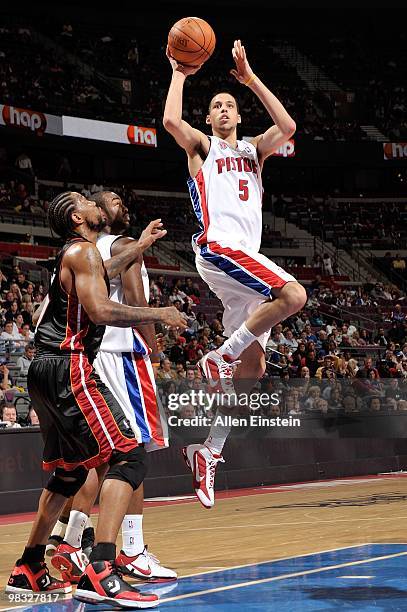 Austin Daye of the Detroit Pistons goes to the basket against Udonis Haslem of the Miami Heat during the game on March 31, 2010 at The Palace of...