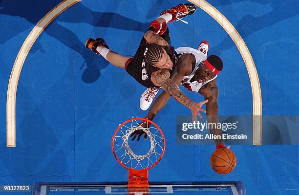 Ben Wallace of the Detroit Pistons goes to the basket against Michael Beasley of the Miami Heat during the game on March 31, 2010 at The Palace of...