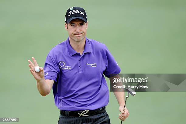 Ross Fisher of England waves to the gallery on the second green during the first round of the 2010 Masters Tournament at Augusta National Golf Club...