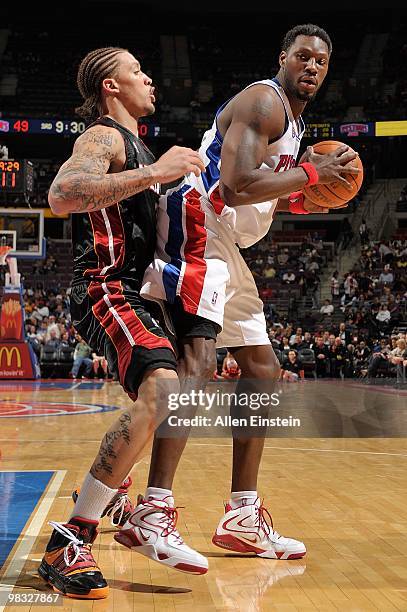 Ben Wallace of the Detroit Pistons handles the ball against Michael Beasley of the Miami Heat during the game on March 31, 2010 at The Palace of...