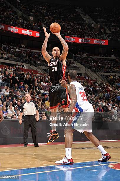 Michael Beasley of the Miami Heat shoots against DaJuan Summers of the Detroit Pistons during the game on March 31, 2010 at The Palace of Auburn...