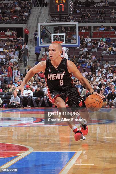 Carlos Arroyo of the Miami Heat drives against the Detroit Pistons during the game on March 31, 2010 at The Palace of Auburn Hills in Auburn Hills,...