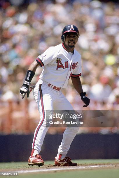 Luis Polonia of the California Angels leads off during the game against the Oakland Athletics at Anaheim Stadium on June 21, 1992 in Anaheim,...