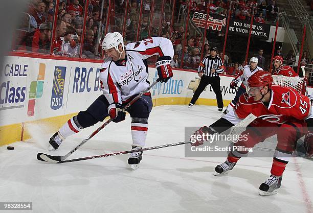 Alexandre Picard of the Carolina Hurricanes pressures Mike Knuble of the Washington Capitals during the NHL game on March 18, 2010 at the RBC Center...