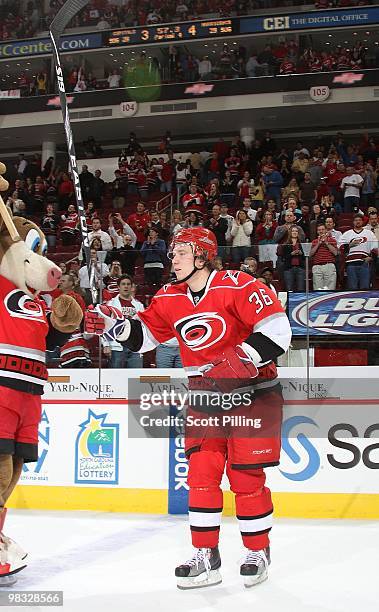 Jussi Jokinen of the Carolina Hurricanes waves to fans as they announce him as one of the three stars of the game following the NHL game against the...