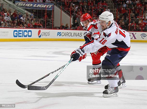 Brandon Sutter of the Carolina Hurricanes attempts to redirect a shon on net by Eric Belanger of the Washington Capitals during the NHL game on March...