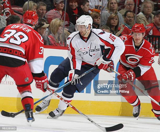 Eric Fehr of the Washington Capitals skates the puck down ice during the NHL game against the Carolina Hurricanes on March 18, 2010 at the RBC Center...