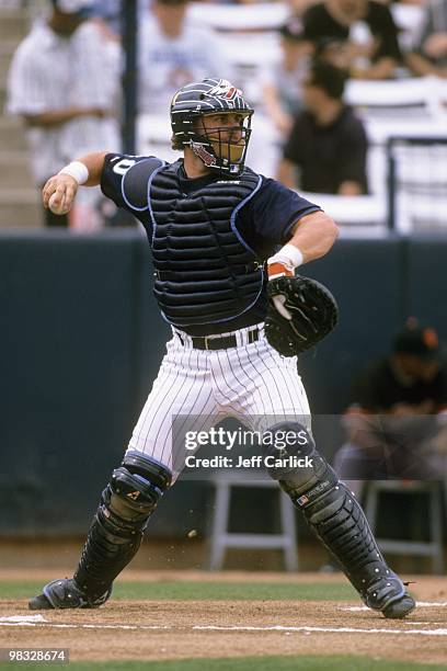 Phil Nevin of the Anaheim Angels throws during a spring training game against the San Francisco Giants at Tempe Diablo Stadium on March 20, 1998 in...