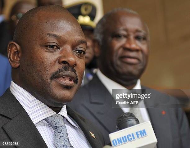 Burundi's President Pierre Nkuruziza speaks to the press as Ivory Coast's President Laurent Gbagbo looks on after their meeting at the Presidential...