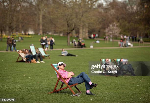 Man looks up at the sun from a deckchair in the warm spring weather in St James's Park on April 8, 2010 in London, England. Temperatures in Britain...