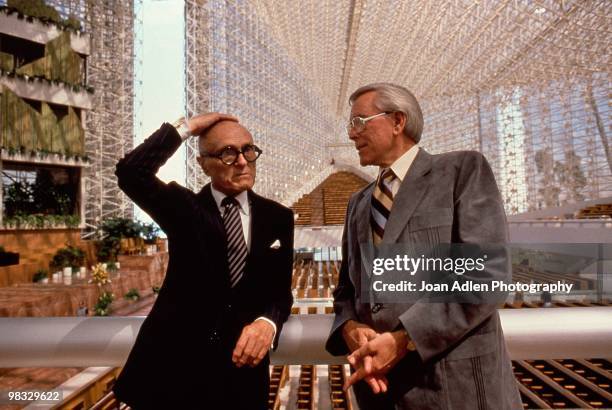 Architect Phillip Johnson and Robert Schuller pose for a photo in the newly constructed Crystal Cathedral in 1980 in Garden Grove, California.