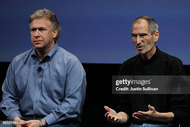 Apple CEO Steve Jobs and Apple Senior Vice President of Worldwide Marketing Phil Schiller answer questions from the press during a Q & A session...