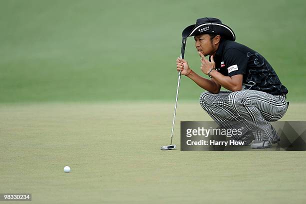 Shingo Katayama of Japan lines up a putt on the second green during the first round of the 2010 Masters Tournament at Augusta National Golf Club on...