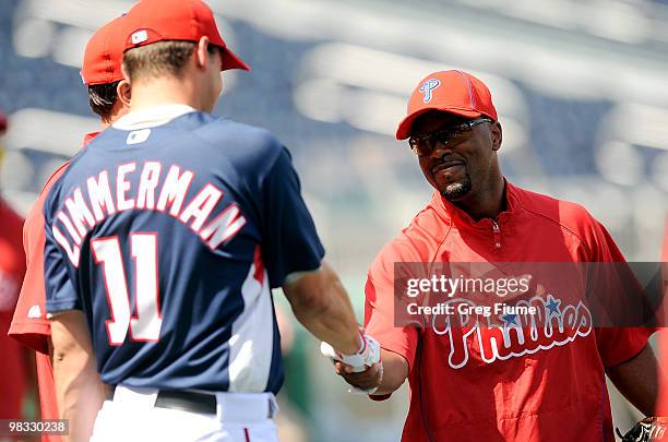 Jimmy Rollins of the Philadelphia Phillies talks to Ryan Zimmerman of the Washington Nationals before the game at Nationals Park on April 8, 2010 in...