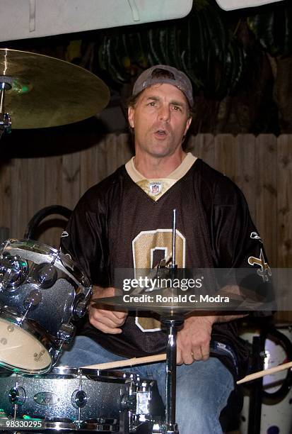 Former NFL quarterback Doug Flutie plays the drums with The Fluties Brothers Band at the 2010 Gridiron Greats Billfish Bowl at Jimmy Johnson's Bill...