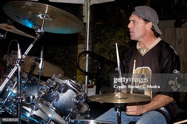 Former NFL quarterback Doug Flutie plays the drums with The Fluties Brothers Band at the 2010 Gridiron Greats Billfish Bowl at Jimmy Johnson's Bill...