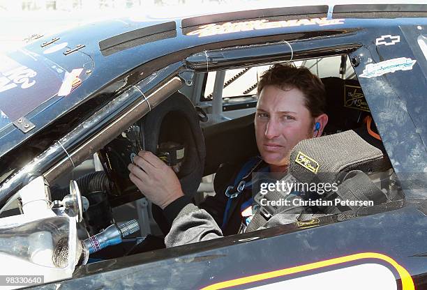 Johnny Borneman driver of the Twisted X Boots/Red Line Oil Chevrolet prepares to drive during practice for the Jimmie Johnson Foundation 100 NASCAR...