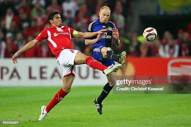 Igor De Camargo of Liege challenges David Jarolim of Hamburg during the UEFA Europa League quarter final second leg match between Standard Liege and...