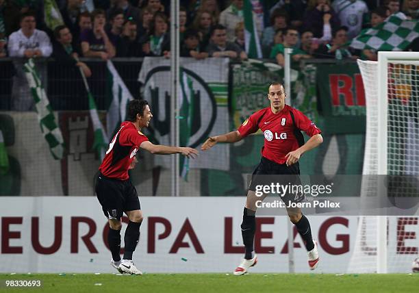 Bobby Zamora of Fulham celebrates with his team mate Simon Davies after scoring his team's first goal during the UEFA Europa League quarter final...