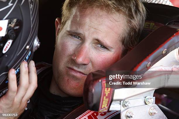 Jason Bowles, driver of the Childress Institute for Pediatric Trauma Chevrolet, prepares to drive during practice for the Jimmie Johnson Foundation...