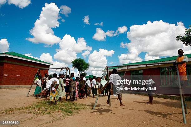 Madonna's Tour of one of the Raising Malawi initiative's - Mphandula Childcare Centre which supports over 350 Children from the surrounding Namitete...